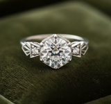 Art Deco engagement ring on dark olive green velvet