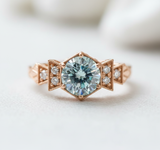 Florence Ring - Rose Gold with Ice Blue Diamond on Light Background