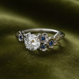 Ring on dark olive green velvet