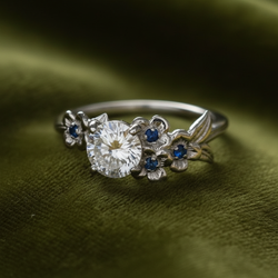 Ring on dark olive green velvet