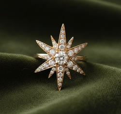 Starburst ring on dark olive green velvet