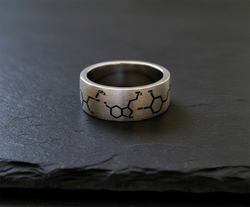 The Chemist Ring on Black Slate